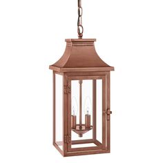 an outdoor hanging lantern with three candles