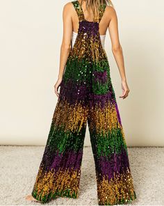 Mardi Gras Sequin Overalls.  This Mardi Gras Sequin Overalls     will have you so cute for all of the parades y’all!   Oversized fit  💜💚 💛THIS PREORDER SHIPS MID DECEMBER   📌  𝗧𝗛𝗘𝗥𝗘  𝗔𝗥𝗘  𝗡𝗢  𝗖𝗔𝗡𝗖𝗘𝗟𝗟𝗔𝗧𝗜𝗢𝗡𝗦   𝗢𝗡   𝗣𝗥𝗘𝗢𝗥𝗗𝗘𝗥  𝗜𝗧𝗘𝗠𝗦 ! 𝗪𝗲  𝗽𝘂𝗿𝗰𝗵𝗮𝘀𝗲  𝘁𝗵𝗲𝘀𝗲   𝗶𝘁𝗲m𝘀  𝗳𝗿𝗼𝗺  𝗼𝘂𝗿  𝗩𝗲𝗻𝗱𝗼𝗿  𝘄𝗵𝗲𝗻  𝘆𝗼𝘂𝗿   𝗼𝗿𝗱𝗲𝗿  𝗶𝘀   𝗽𝗹𝗮𝗰𝗲𝗱 . Mardi Gras Party Outfit, Mardi Gras Dress, Mardi Gras Ideas, Long Overalls, Mardi Gra, Overalls Dress, Mardi Gras Outfits, 21st Birthday Party, Sequin Jumpsuit