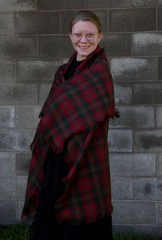 The brown and red plaid, Canadian Maple Leaf tartan blanket scarf can be added to the winter coat you have or wear it to top off that sweater you feel so comfortable in. It makes a great over-sized scarf gift for that special lady on your list. Cozy up your room my tossing this across your favorite chair as a throw. This scarf is made of the same Maple Leaf tartan pattern that the Duchess of Cambridge wore in Canada. More recently Princess Kate wore it on their Royal Tour. Be practical and wear