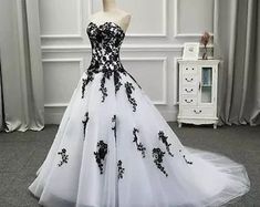 a black and white ball gown is on display