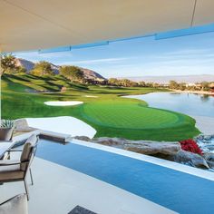 an outdoor dining area overlooking a golf course