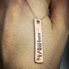 This is a beautiful solid copper pendant which has been hand stamped with your chosen name in ancient Ogham alphabetPLEASE BE AWARE THE ESTIMATED DELIVERY DATE IS GIVEN BY ETSY AND NOT ME AS A SELLER. IT IS JUST AN ESTIMATE AND DOES NOT TAKE ONTO ACCOUNT BUSY PERIODS OR ANY DELAYS THAT MAY OCCUR WHICH IS ENTIRELY OUT OF MY HANDS. Personalized Bronze Pendant Jewelry, Unique Stamped Anniversary Necklaces, Personalized Bronze Pendant Necklace, Personalized Gold Copper Necklace, Symbolic Stamped Necklace For Anniversary, Symbolic Stamped Necklace For A Gift, Symbolic Stamped Necklace For Gift, Bronze Stamped Jewelry For Anniversary, Hand Stamped Gold Copper Jewelry