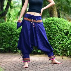 "Navy Blue Tribal pants, Hmong pants, Hilltribe pants, Thai baggy pants, Unisex New Design Trible pants, these pants is inspired by Hmong pants, Who live in the North of Thailand. Change to a new design for everyone, modernize, and awesome. This item is made of high-quality cotton in the north of Thailand. Printed with Special technique and making with Craftsmanship from our shop, Who has sewing experience over 30 years. Sizing: One size fits most (Unisex ) Elastic Waist : 26\" - 38\" Length :36 Baggy Blue Bottoms For Festival, Harem Pants With Pockets For Festivals, Festival Harem Pants With Pockets, Blue Wide Leg Harem Pants For Festival, Baggy Blue Pants For Festivals, Traditional Pants With Pockets For Festival, Traditional Wide Leg Parachute Pants For Festivals, Traditional Baggy Wide Leg Pants, Blue Harem Pants With Pockets For Festival