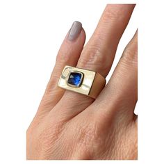 This exceptionally chic bespoke ring showcases a vibrant blue 2.51-carat unheated Ceylon sapphire from the Art Deco era. The sugarloaf sapphire is bezel-set and centered on a softly rounded rectangular face, substantially crafted in 21.9 grams of 14k gold. Accompanied by a gemological report from AGL stating: No evidence of heat enhancement, Ceylon (Sri Lanka) origin. Currently a size 5 1/2. Measurements: 11.56 x 18.74 mm Rectangular Face, Bespoke Rings, Ceylon Sapphire, No Heat, Art Deco Era, Vibrant Blue, Signet Ring, Bezel Setting, Metal Jewelry