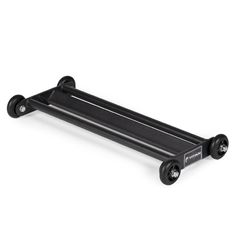 an image of a black skateboard with wheels