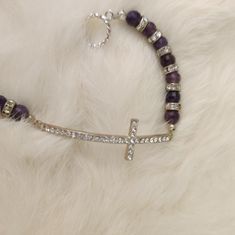 Handmade Jewelry New Without Tag Silver Cross And Purple Shiny Beads Chain Approximately 3" Long Adjustable Silver Beaded Bracelets With Cross Shape, Adjustable Silver Cross Beaded Bracelets, Adjustable Silver Beaded Cross Bracelets, Silver Cross Jewelry With Beads, Elegant Silver Cross Beaded Bracelets, Elegant Cross Metal Bracelets, Elegant Silver Beaded Cross Bracelets, Elegant Metal Cross Bracelet, Elegant Cross-shaped Metal Bracelet