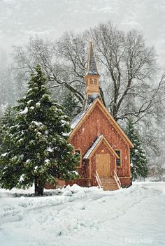 a small wooden church in the snow