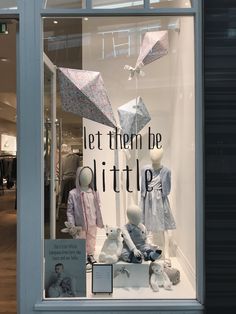 there is a display in the window of a clothing store