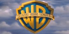 the logo for warner home video is shown in front of a blue sky with clouds