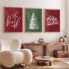 three red and white christmas paintings in a living room