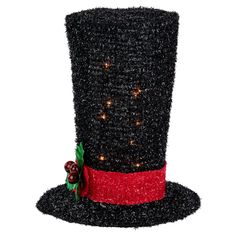 a black top hat with red ribbon and lights on the side, decorated with holly berries