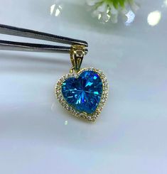 Vintage 15K 610 Solid Gold Blue Topaz & White Topaz Heart Pendant...Marked 610 means 61% of Gold... Total of weights 2.2grams. Measure includes the Bail H 3/4'' W 1/2''....Measure of stone 10 x 10MM...It's in very good condition. Heart Cut Blue Topaz Jewelry Gift, Blue Topaz Heart Cut Jewelry, Heart-shaped Blue Topaz Jewelry For Weddings, Blue Topaz Heart Pendant Necklace For Gift, Yellow Gold Blue Topaz Pendant, White Topaz, Blue Topaz, Heart Pendant, Pendant Necklaces