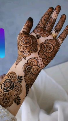 a woman's hand with henna on it and the logo for instagram