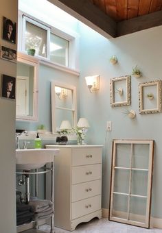 a bathroom with a vanity, sink and mirror