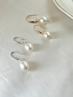 A classic pearl set! made with real freshwater pearls and offered in Sterling Silver and 14k gold filled options. Hypoallergenic, anti tarnish and water resistant to last forever. This jewellery set is the perfect present regardless of the occasion, no matter if you are a bride -to be shopping for her perfect bridal pearls or looking for a Valentines Day Gift, birthday gift, or anniversary gift, this pearls will be loved by all. PRODUCT DETAILS - Necklace: 46cm in length plus 3cm adjustable end Everyday Pearl Drop Jewelry, Everyday Drop Pearl Jewelry, Classic Drop Jewelry With Pearl Drop, Oval Pearl Drop Earrings Gift, Classic Drop Jewelry With Pearl Detail, Classic Drop Pearl Drop Jewelry, 14k Gold Filled Pearl Drop Necklace For Wedding, Oval Pearl Jewelry For Gift, Oval Pearl Earrings For Anniversary