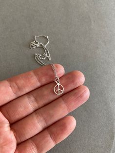 Tiny Mini Peace Silver Necklace Sterling Silver NS1008 - Etsy Adjustable Sterling Silver Peace Sign Jewelry, Silver Dainty Charm Necklace 16 Inch, Dainty Silver Charm Necklace 16 Inch, Silver Peace Sign Jewelry Gift, Adjustable Peace Sign Necklace As Gift, Peace Sign Jewelry For Gifts, Adjustable Peace Sign Necklace, Nickel-free Minimalist Necklace, Small Minimalist Nickel Free Necklace