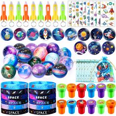 space themed party supplies including plastic cups and spoons