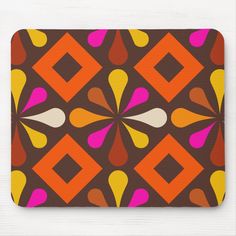 an orange, pink, and yellow abstract design mouse pad