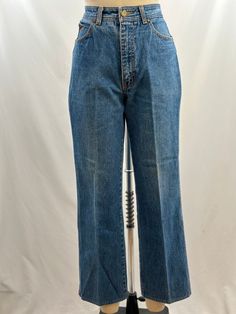 What is more 80s than Sergio Valente? In a medium denim wash, they have a straight leg, white stitch detailing and of course the iconic bull head embroidery. With a pair of oxfords and white tee, oh yes!  -80s Sergio Valente -Light wash, straight leg -Machine wash recommended  Measurements:  *Waist 14  1/2 inches *Hips 17 1/2 inches *Inseam 27 inches *Length 37 1/4  inches *This item is pre-loved and there may be minor flaws to the garment. Not to worry if there is anything major we will let you Sergio Valente Jeans, Oxford Jeans, 80s Jeans, Fits Aesthetic, Bull Head, Womens Jeans, White Tee, High Jeans, Jeans Denim