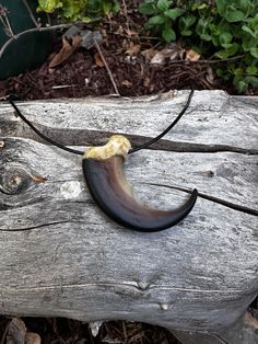 a piece of wood with a banana on it