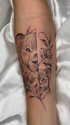 a black and white tattoo on the leg of a person with an animal head behind it