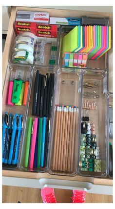 an organized drawer with pens, pencils, markers and other crafting supplies in it