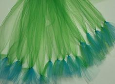 green and blue tulle skirt on white background