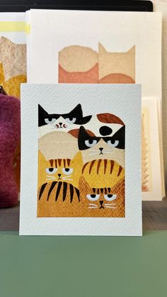 two cards with cats on them sitting next to each other