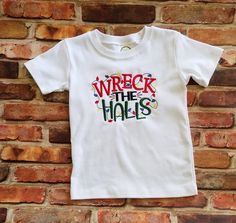 This boy Christmas shirt is a perfect description of your active little boy!  We just add a little humor to the preschool or friend's holiday parties! "Wreck the Halls"  is a cute play on words for the busiest of boys! The design is embroidered on a white 100% cotton, boutique quality shirt or a basic baby bodysuit.  Please message me with any custom request prior to purchasing.   All embroidered items are finished with a soft backing to protect sensitive skin from scratchy stitches. Wash inside out on gentle cycle and hang to dry. Do not use bleach. Iron inside out on low heat without steam. All of our items are made in our smoke free and pet free studio. Preschool Holiday Party, Boys Christmas Shirt, Girl Burp Cloths, Boy Monogram, Christmas Party Shirt, Christmas Shirt Funny, Christmas Party Shirts, Monogram Shirts, Burp Cloth Set