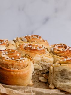 rolls with almonds and powdered sugar on top