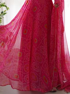 Introducing our stunning "pretty pink bandhani printed chiffon festival wear gown with dupatta" - a must-have for your festive wardrobe! This beautiful pink color gown features intricate bandhani print work, adding a touch of traditional charm. The chiffon fabric adds a touch of elegance, making it perfect for festivals, functions, and special events.
The matching chiffon dupatta with bandhani print work and fancy lace border work completes the look, giving you a coordinated and stylish outfit. Pink Dress With Printed Motifs And Traditional Drape, Pink Sharara With Printed Motifs And Traditional Drape, Georgette Saree With Dupatta, Georgette Saree With Dupatta Maxi Length, Pink Anarkali Set With Printed Motifs For Festive Occasion, Festive Pink Anarkali Set With Printed Motifs, Bohemian Pink Sharara With Sheer Dupatta, Bollywood Style Georgette Maxi Saree, Festive Pink Sharara With Printed Motifs