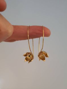 Drop gold blooming flower earrings. Designer delicate dangle earring. wedding jewelry. Romantic gift for her. everyday minimalist. This is a gold plated earrings. It is a blooming flower dangle earrings, a small delicate minimalist earrings that can be worn every day. It is a beautiful piece perfect for giving to a special someone or as a gift or to yourself. Its a great gift for sister, graduation, bridesmaid gifts, girlfriend, good friends, mother gift for all seasons. All my gold plated earri Gold Flower Pendant Earrings For Wedding, Gold Flower-shaped Earrings For Wedding, Gold Flower Earrings For Wedding With Birth Flower, Gold Flower Earrings With Birth Flower For Wedding, Gold Birth Flower Earrings For Wedding, Delicate Birth Flower Earrings For Anniversary, Delicate Birth Flower Earrings, Brass Drop Earrings With Flower Charm, Dainty Flower Charm Earrings For Anniversary