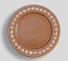 a brown plate sitting on top of a table