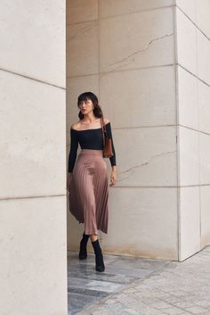 Nothing completes a knock-out look quite like our Megan Drop-Waist Pleated Silk Skirt. Romantic and flowing with softest crepe de chine silk. Guaranteed to ring in the compliments long after the day is over. Elegant drop-waist pleated skirt Midi length A line silhouette Flowy silk skirt Off Shoulder Back Design, Midi Skirt Pleated Outfit, One Shoulder Top With Skirt, Tops With Pleated Skirts, Tops With Midi Skirts, Colorful Midi Skirt Outfit, Crepe Skirt Outfit, A Line Long Skirt Outfits, Elegant Pleated Skirt Outfit