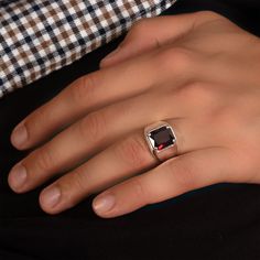 Unleash your inner style icon with our Ruby Silver Ring, a bold and striking jewelry masterpiece. At MyJewelist, we are here to redefine your style, offering you a unique piece that reflects your individuality and adds a touch of cool sophistication to your look. Our Ruby Silver Ring isn't just an accessory; it's a reflection of your distinctive style. When you wear it, you'll radiate confidence and charm, effortlessly grabbing attention wherever you go. ० UNMATCHED COMFORT, IMPECCABLE STYLE ० Concerned about comfort? No worries! Our jewelry is meticulously designed with your comfort in mind. We exclusively use hypoallergenic, nickel-free materials, ensuring you look and feel your absolute best. ० DETAILS ० ★CRAFTED TO PERFECTION: The Ring is a testament to precision and craftsmanship, met Luxury Red Men's Ring As Gift, Modern Red Ring For Formal Occasions, Modern Red Rings For Formal Occasions, Modern Red Jewelry For Anniversary, Modern Silver Rings With Ruby, Modern Silver Ruby Rings, Modern Ruby Open Ring For Gift, Modern Ruby Open Ring As Gift, Modern Open Ruby Ring As Gift