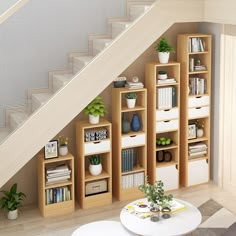 a living room with bookshelves, coffee table and stairs leading up to the second floor