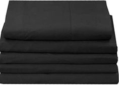 four black sheets folded on top of each other