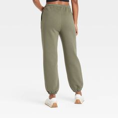 Level up your fashion game with these Fleece Mid-Rise Cinched Jogger Pants from JoyLab™. Made of cotton and recycled polyester with added spandex, these cinched pants feature a full elastic waistband with drawstrings for a stay-put fit. Tailored in an athletic fit, these jogger pants pair well with a wide variety of T-shirts and crop tops. JoyLab™: A movement that’s always in motion. Green Athleisure Sweatpants With Elastic Waistband, Mid-rise Stretch Sweatpants With Elastic Waistband, Mid-rise Athleisure Joggers With Elastic Waistband, Casual Green Moisture-wicking Sweatpants, Athleisure Joggers With 4-way Stretch And Elastic Side Panels, Shipt Shopper, Womens Fleece, Jogger Sweatpants, Athletic Fits