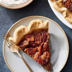 a slice of pecan pie on a plate with a fork