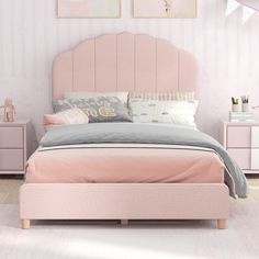 a bedroom with pink walls and furniture in it