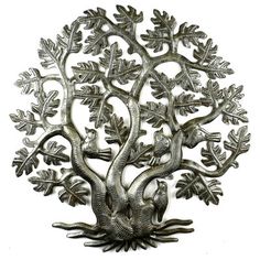 a metal tree with leaves and birds on it