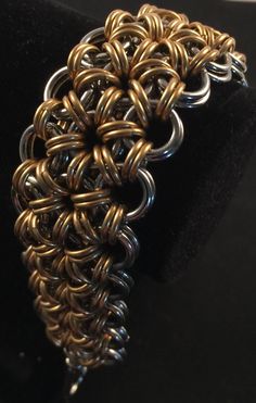 This piece is handcrafted in two different size rings . The rings were saw cut for the cleanest look. This Bracelet is woven in a Japanese style and can be made in any size you wish. Metals such as copper, brass and bronze will darken with age and use. If you wish to bring back the newness of the metal, soak in lemon juice for about 5 minutes and rinse with water. Thank you for viewing Handmade Gold Chain Bracelet, Handmade Metal Bracelet In Brown, Handmade Brown Metal Bracelet, Handmade Metal Bangle Chain Bracelet, Handmade Metal Chain Bracelet, Metal Chainmail Bracelets As Gift, Handmade Brown Steampunk Jewelry, Adjustable Gold Chainmail Jewelry, Metal Chainmail Bracelet Jewelry