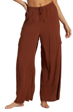 A lightweight crinkle fabric adds airy ease to slouchy wide-leg cargo pants topped with a comfortable elastic-drawstring waist. 27 1/2" inseam; 26" leg opening; 13" front rise; 14" back rise (size Medium) Elastic/drawstring waist Front slant pockets; cargo flap-patch pockets 100% viscose Machine wash, tumble dry Imported Summer Vacation Wide Leg Cargo Pants, Wide Leg Parachute Pants With Pockets For Vacation, Wide Leg Cargo Pants For Summer Vacation, Vacation Wide-leg Cargo Pants With Pockets, Wide-leg Cargo Pants With Pockets For Vacation, Summer Cargo Pants With Elastic Waistband For Vacation, Summer Vacation Wide-leg Cargo Pants, Casual Wide Leg Cargo Pants For Beach, Wide Leg Cargo Pants With Pockets For Vacation