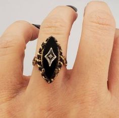 Antique ring that is sterling but has a heavy rolled gold plating on it. Signed E/S Sterling which based on my research is the Austria Jeweler Eduard Stepanek who produced jewelry in Austria from 1867-1922. This is a true 1920s ring with repousse details and tons of ornate details. Excellent condition no missing prongs no gold plating wear on the outside of the ring. Weighs 4.6 grams To view our vintage ring section click on the link below https://www.etsy.com/shop/WhyWeLoveThePast?ref=hdr_shop_ Art Deco Yellow Gold Ring With Black Enamel, Victorian Black Enamel Rings For Anniversary, Victorian Black Enamel Anniversary Rings, Antique Black Enamel Rings For Collectors, Gold Oval Ring With Black Enamel, Antique Black Enamel Collectible Rings, Collectible Oval Ring With Black Enamel, Collectible Oval Black Enamel Rings, Gold Rings With Black Enamel In Fine Jewelry Style