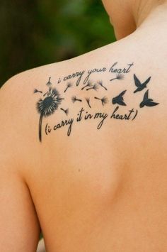 the back of a woman's shoulder with a dandelion tattoo that reads, i carry it in my heart