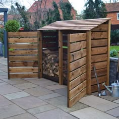 a wooden shed sitting on top of a patio