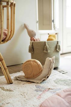 a child's room with a crib, toys and other items on the floor