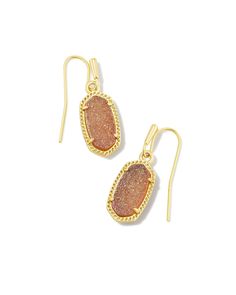 Complete your look with these timeless LEE Drop Earrings. Featuring a stunning gold-toned frame with dramatic Kendra Scott-designed drusy stones, these earrings are perfect for any occasion. Add a touch of glamour to your style with these unique, eye-catching pieces! Kendra Scott Bracelet, Designer Diaper Bag, Kendra Scott Necklace, Kendra Scott Earrings, Kids Sunglasses, Pillow Gift, Gold Drop Earrings, Online Earrings, Brass Material