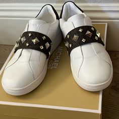 Brand New Mk Kenna Sneaker Beautiful Leather With Mk Logo And Gold Studs Slip On Style With Velcro Strap Michael Kors Leather Slip-on Sneakers, Michael Kors White Slip-on Sneakers, Studded Sneakers, Sneakers Looks, Mk Logo, Michael Kors Shoes, Velcro Straps, Gold Studs, Womens Shoes Sneakers