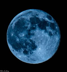 the full blue moon is seen in the dark sky